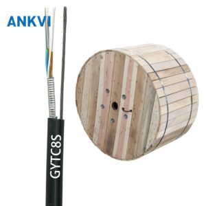 GYTC8S figure-8 self-supporting aerial cable segment on a wooden reel, black jacket printed GYTC8S