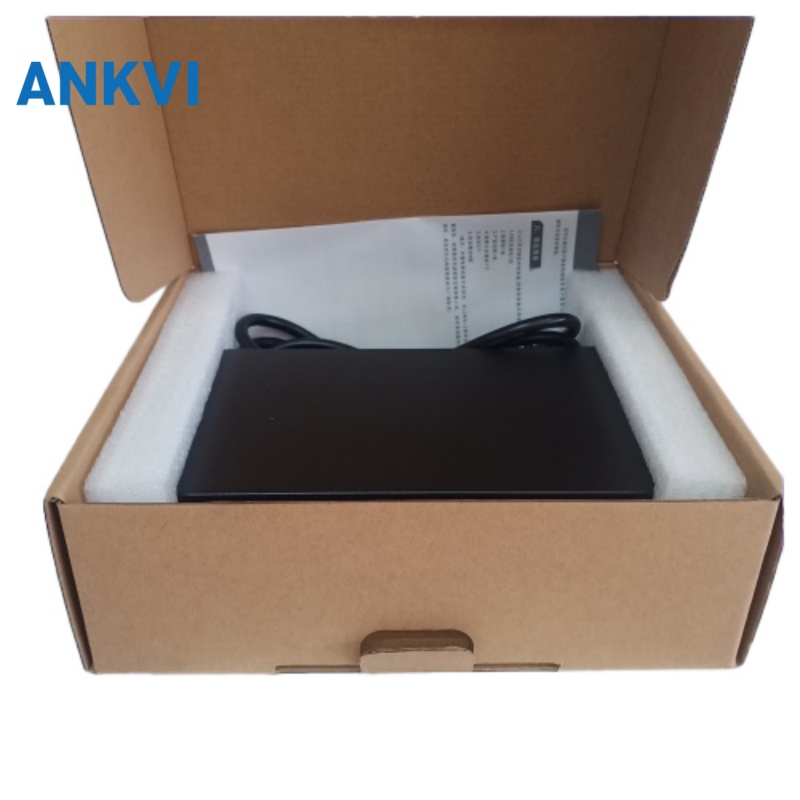 KU-9010G Gigabit PoE switch, open carton showing the switch, power cord and documentation