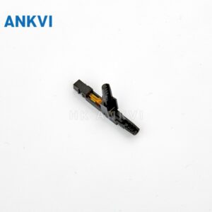 LJZ.010 single fast connector with dark body and small green end lying diagonally