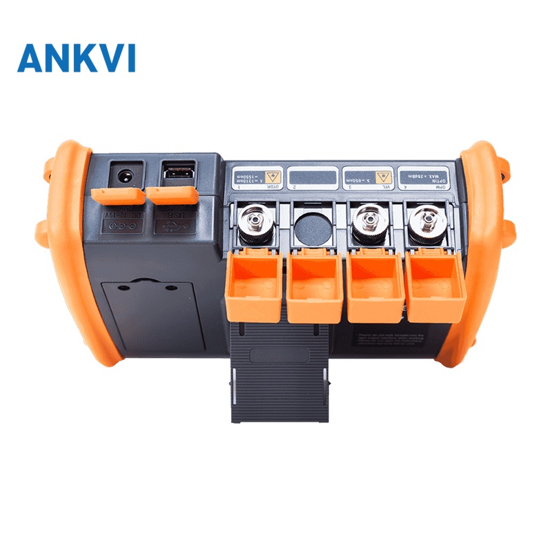 NK5600 OTDR port panel with the orange port covers lifted showing connectors and a flap